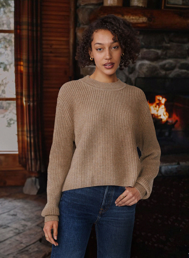 Ribbed Cashmere Tall Collar Sweater in Camel-fire place in the background