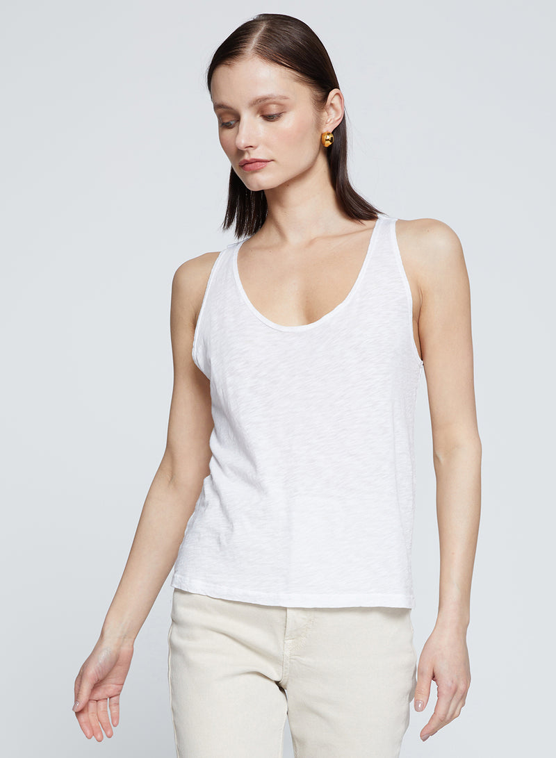 Supima Slub Scooped Tank in White-model is looking down 