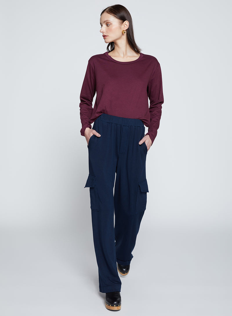 Softest Fleece Wide Leg Cargo Pant in New Navy-model walking 