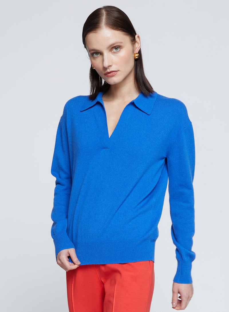 Johnny Collar Sweater in Club Blue-3/4 front view model is tugging at her sweater