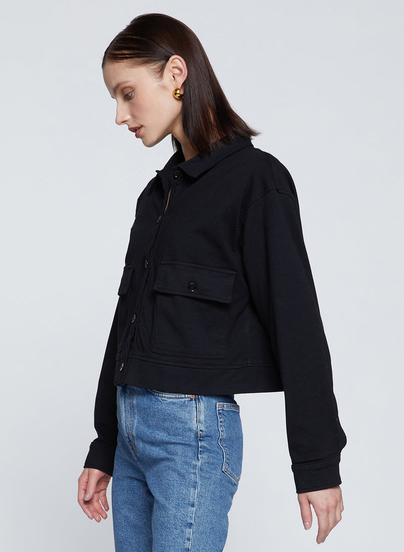 Ponte Cropped Jacket in Black-side view and is looking down 