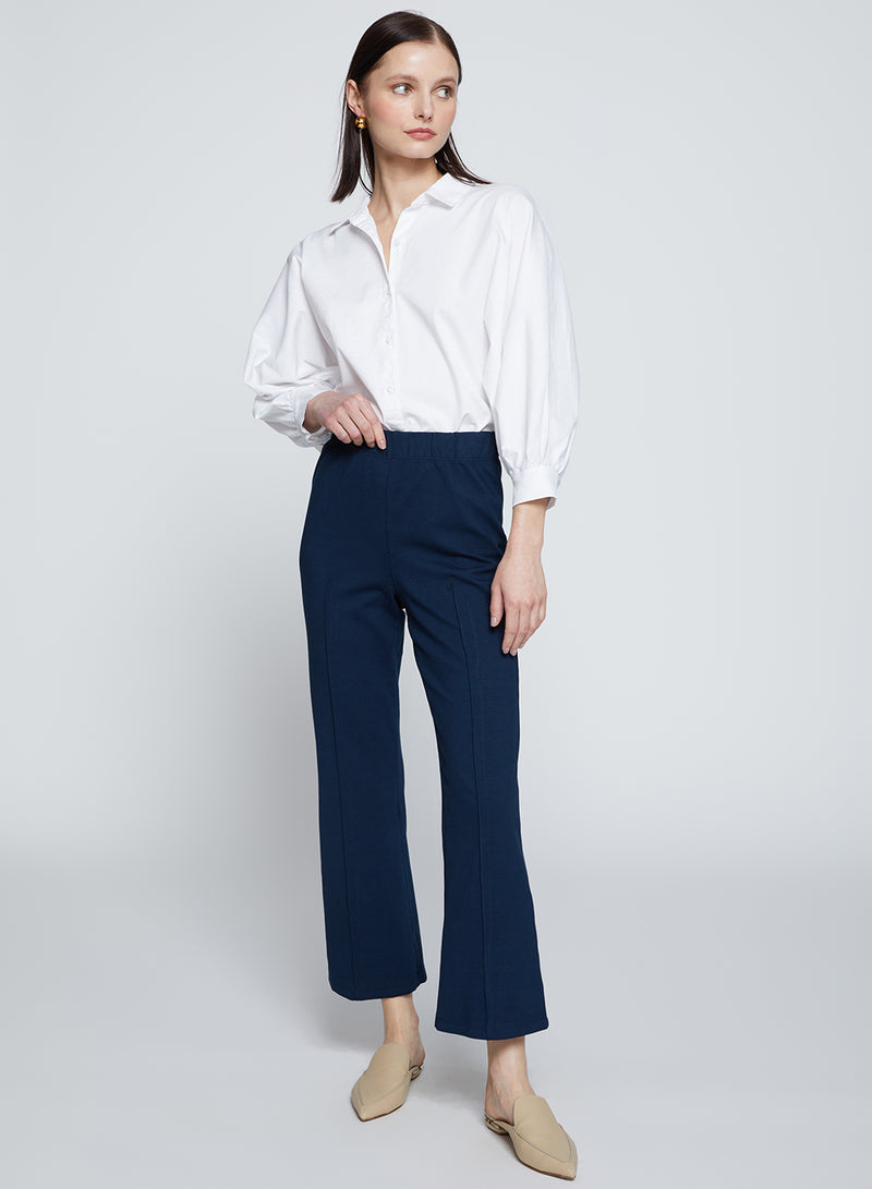 Ponte Cropped Kick Flare Pant in New Navy-full view front  and model is looking away