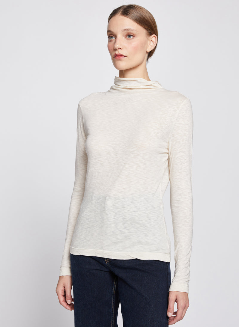 Asymmetric Neck Long Sleeve Top in Cream-half way tilt profile