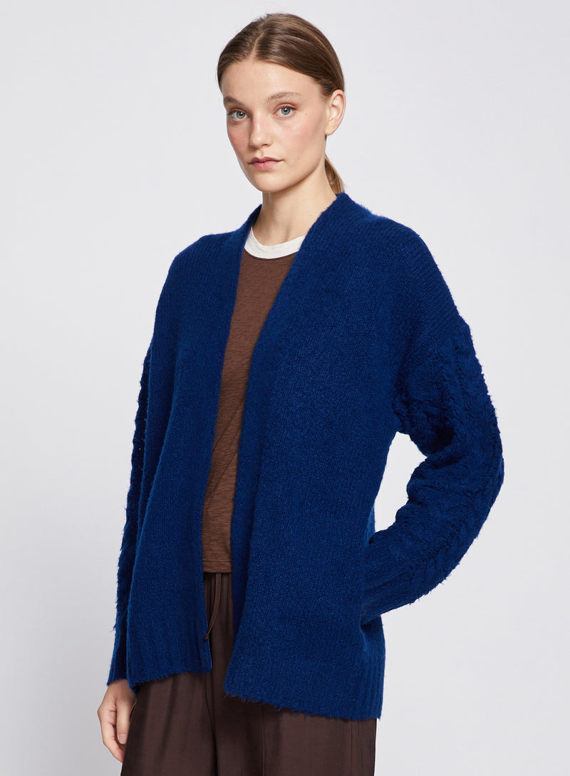 Cableknit Sleeve Cardigan in New Navy- hand in pocket