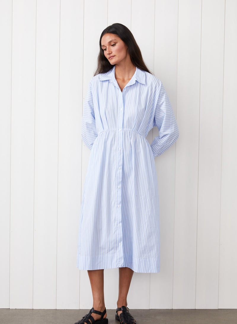 Iberus Stripe Poplin Shirt Dress in Clear Sky Stripe - front view with the model looking to the side