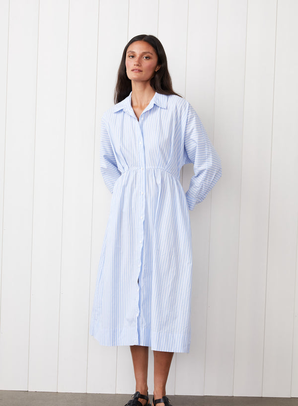 Iberus Stripe Poplin Shirt Dress in Clear Sky Stripe - front view with model having her hands behind her back