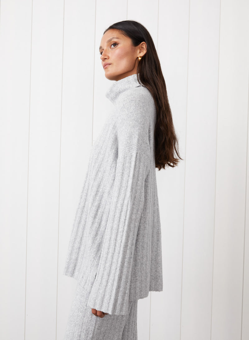 6x6 Rib Turtleneck in Heather Grey - side image with the model looking to the side. 