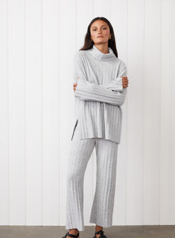 6x6 Rib Turtleneck in Heather Grey - front image with the model folding her arms 