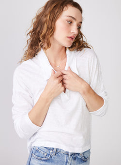 Supima Slub Long Sleeve Johnny Collar Tee in White - front view hands at neckline