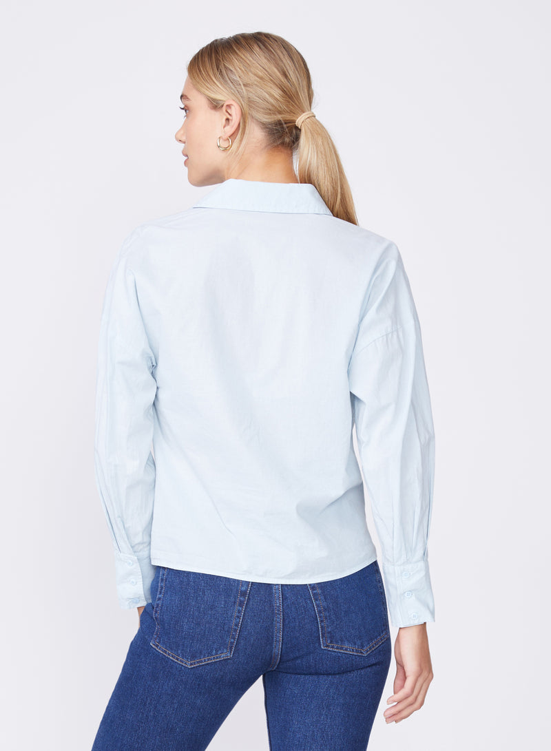 light blue twist front poplin shirt