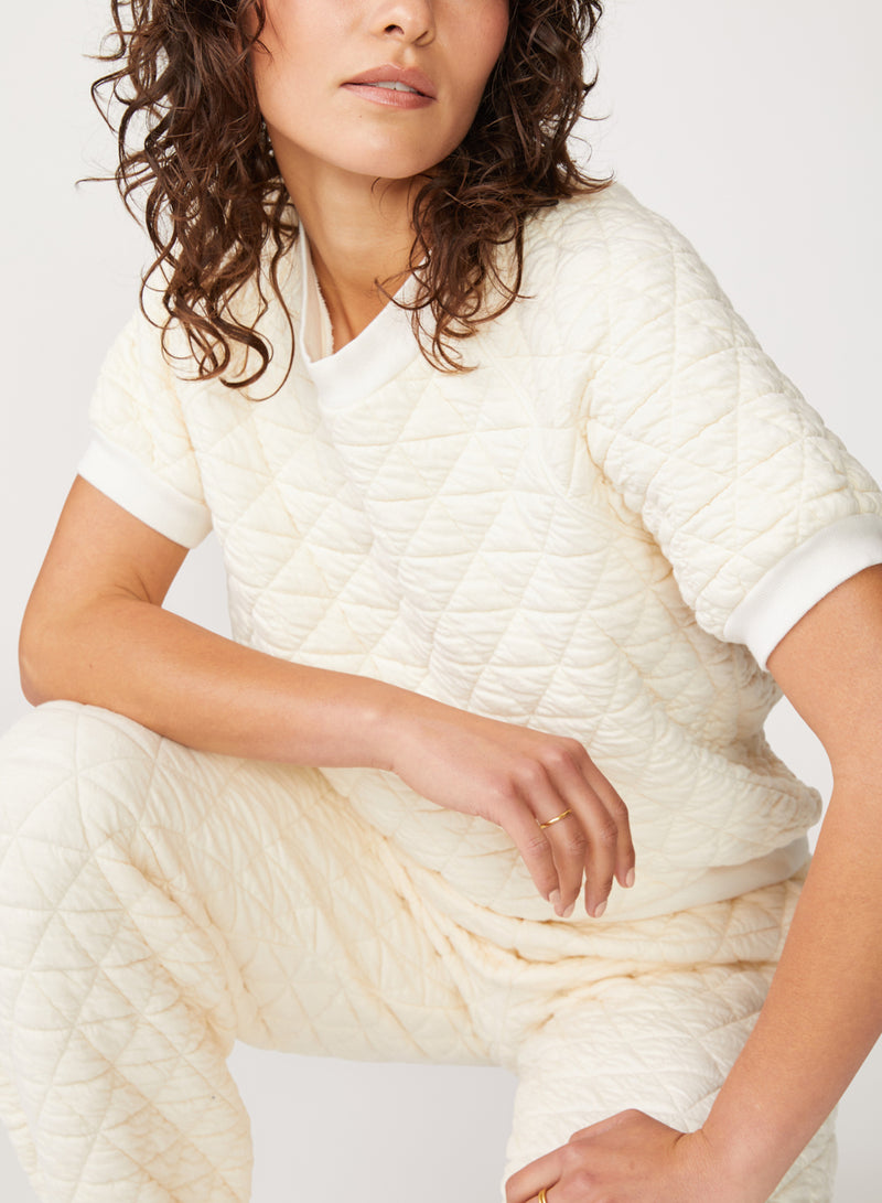 cream quilted knit top