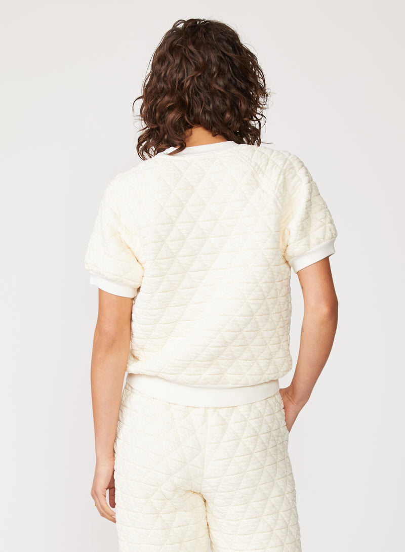 cream quilted knit top