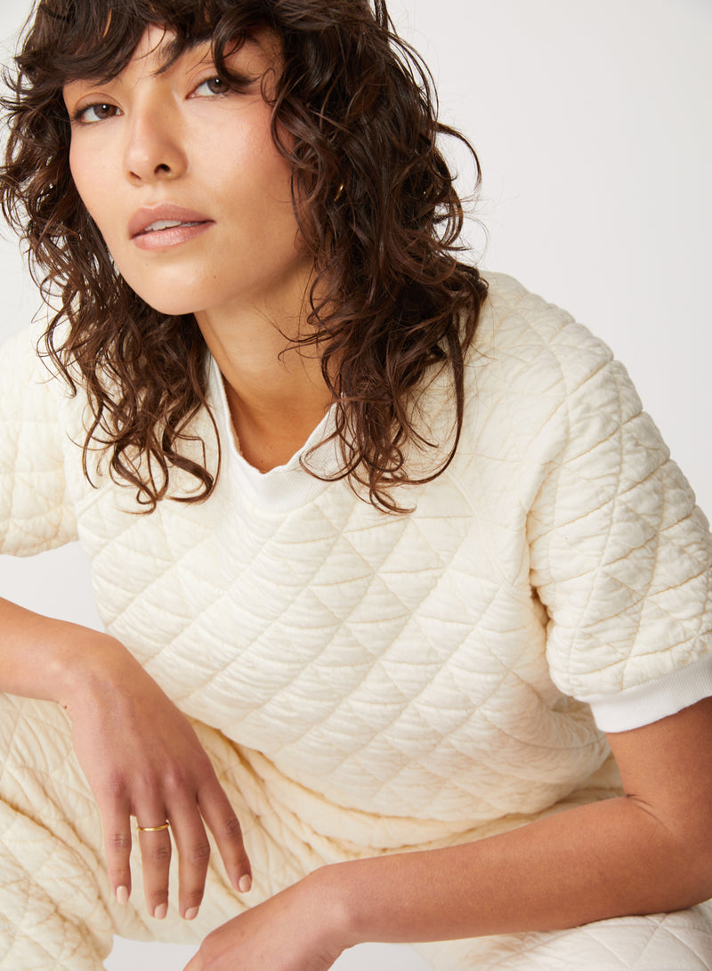 cream quilted knit top