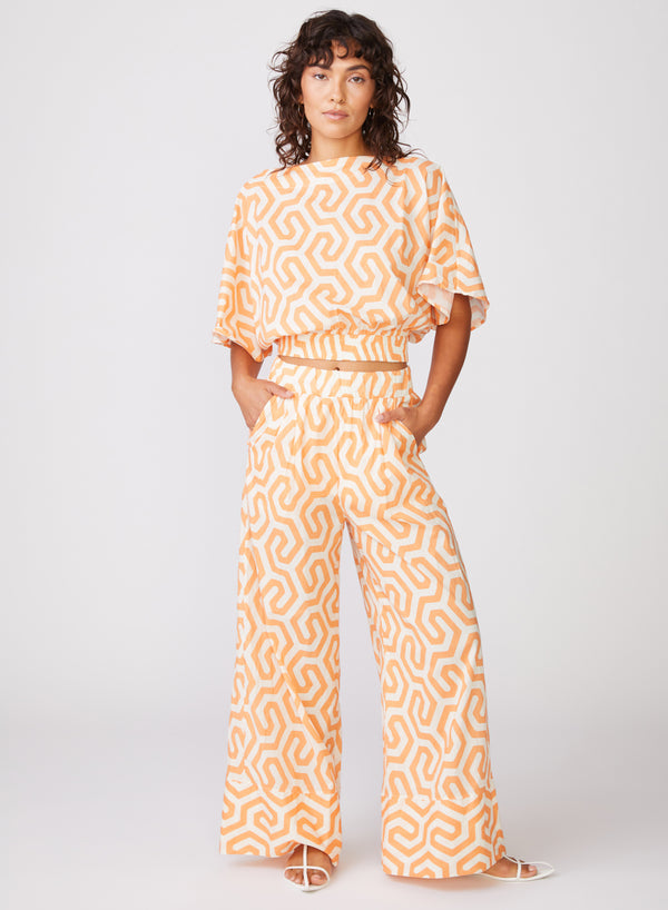 Geo Print Voile Wide Leg Pant in Cantaloupe - front hands in pocket