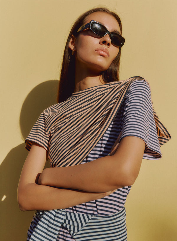 Mini Navy Stripe Short Sleeve Crew in Cantaloupe- layered on top of navy striped tee
